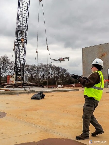Industrial Drone Photographer catching a drone.